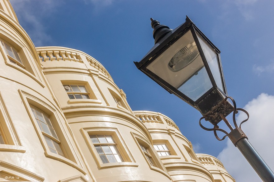 Regency town houses in Brunswick square Brighton with victorian street lamp against blue sky 2014 eyeteeth.net