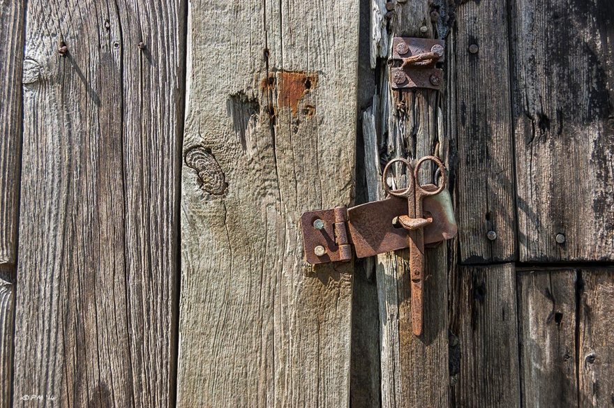 Rusty Hasp with scissors used as lock, old distressed wood, abstract. Colour. eyeteeth.net 2014