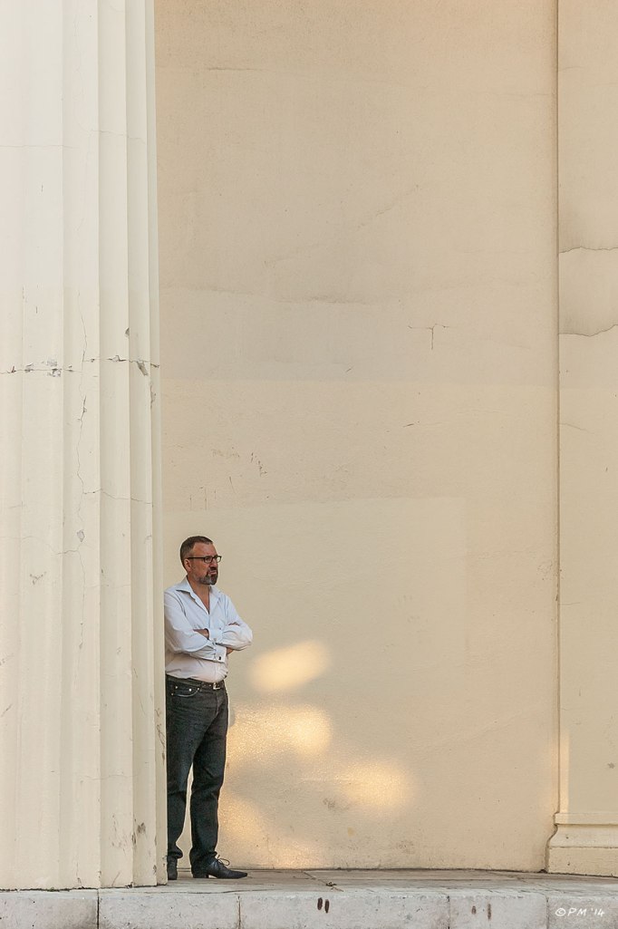 Man standing at the foot of a pillar on steps of Brighton Unitarian Church abstract urban 2014 eyeteeth.net