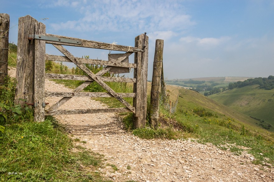 Landscape with weathered wooden gate over chalk path on hillside at Devil's Dyke South Downs National Park, West Sussex UK P.Maton 2014 eyeteeth.net