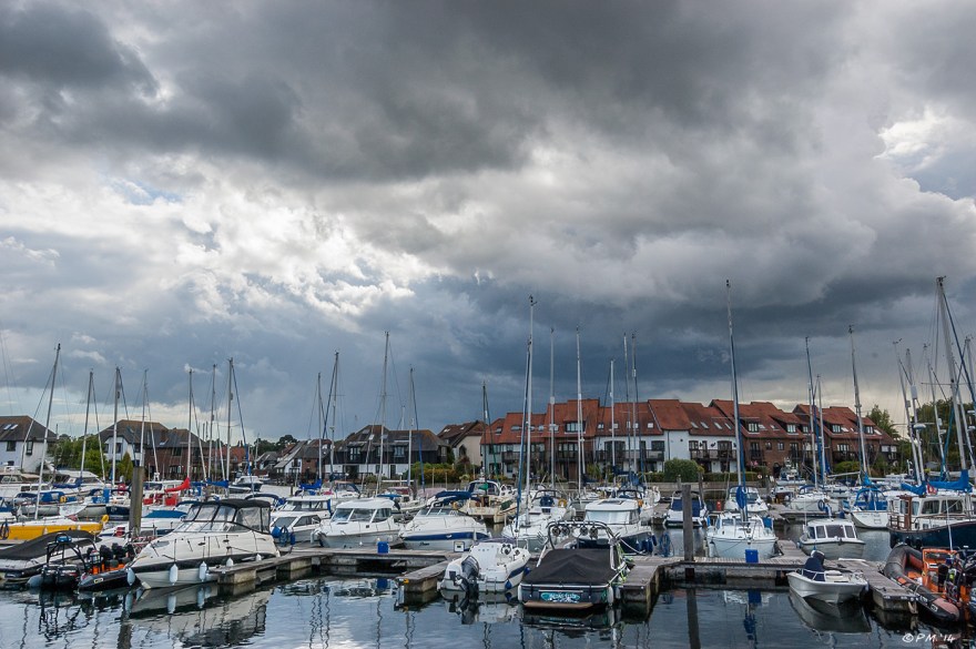 Sailing boats moored with dramatic sky Hythe Marina Village, Hampshire UK P.Maton 2014 eyeteeth.net