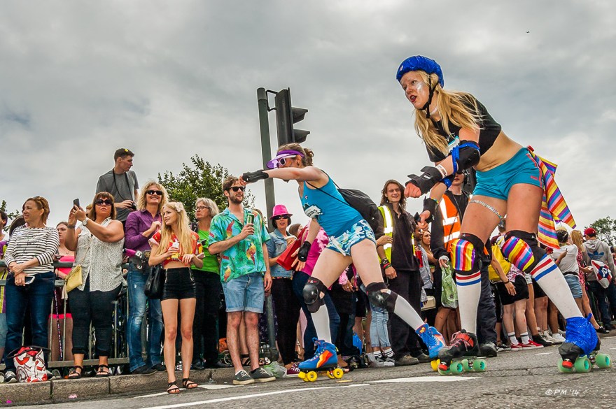 Girls in hot pants rollerskating  in parade at Gay Pride Brighton UK P. Maton 2014