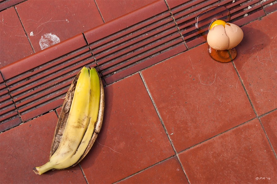 Banana skin and broken egg on red ceramic steps, colour, Brighton UK. P.Maton 2014 eyeteeth.net