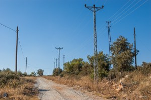 Cable masts along dirt road. Patara Turkey. Landscape Colour. P.Maton 2014 eyeteeth.net