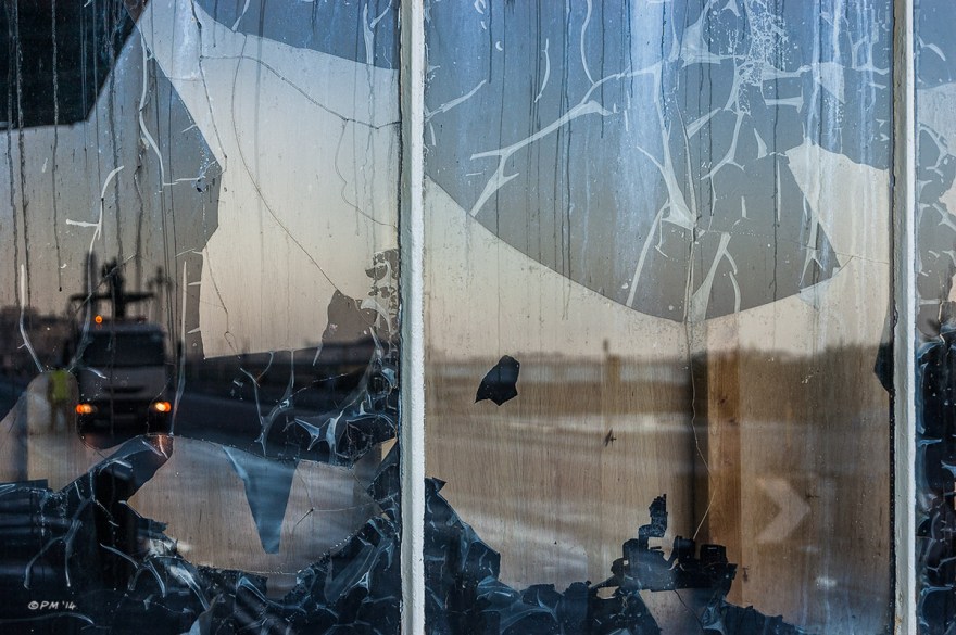 Dawn sky with council lorry reflected in distressed window of Concorde 2 nightclub Brighton Seafront UK. Colour Landscape. © P. Maton 2014 eyeteeth.net