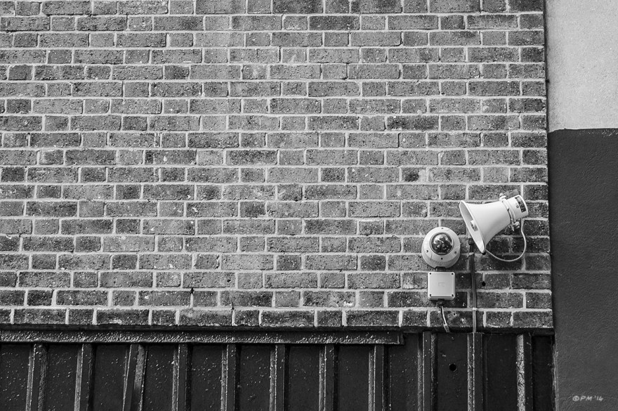 Security camera and loudspeaker on brick wall. Abstract Monochrome landscape. © P. Maton 2014 eyeteeth.net