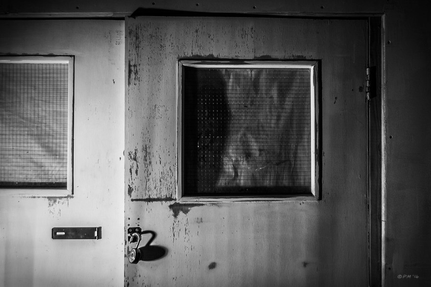 Unlocked internal door with blocked out reenforced glass windows, Coachwerks Brighton UK. Abstract Monochrome Landscape. © P. Maton 2014 eyeteeth.net