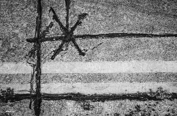 Bitumen / Tar repair on asphalt road with double yellow lines. Brighton UK. Abstract Urban Street Photography. Monochrome Landscape.  P. Maton 2015 eyeteeth.net