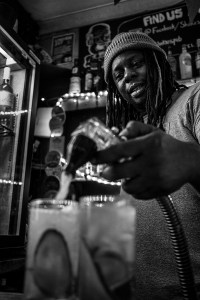 man using soda pump behind bar at Shakespeare's Head pub Brighton uk. Black and white portrait. Urban nightlife photography @P. Maton 2017 eyeteeth.net