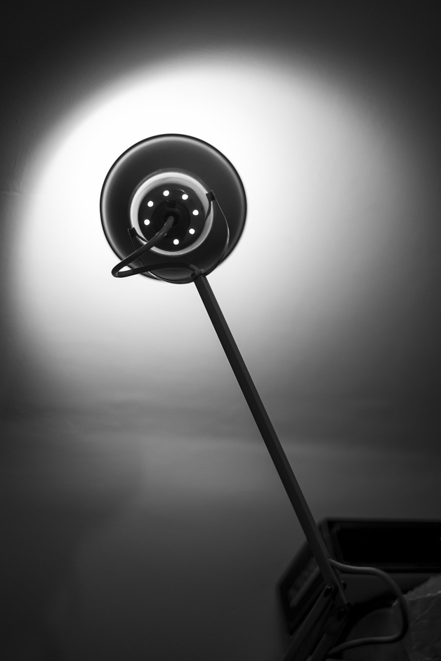 Standard lamp desk lamp pointed at wall with light falloff creating silhouette, black and white monochrome still life objects © P. Maton 2018 eyeteeth.net